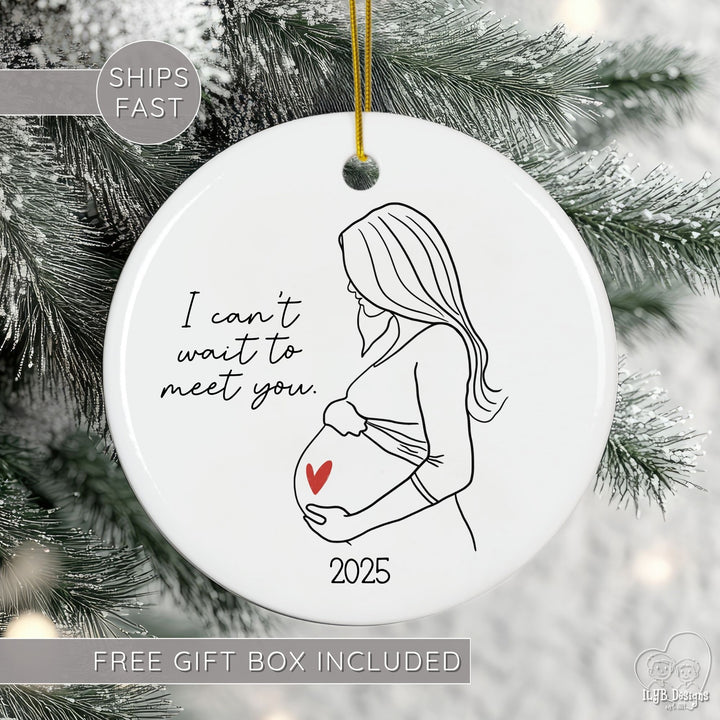 Ornament with a pregnancy illustration and text 'I can't wait to meet you. 2025' on a Christmas tree.