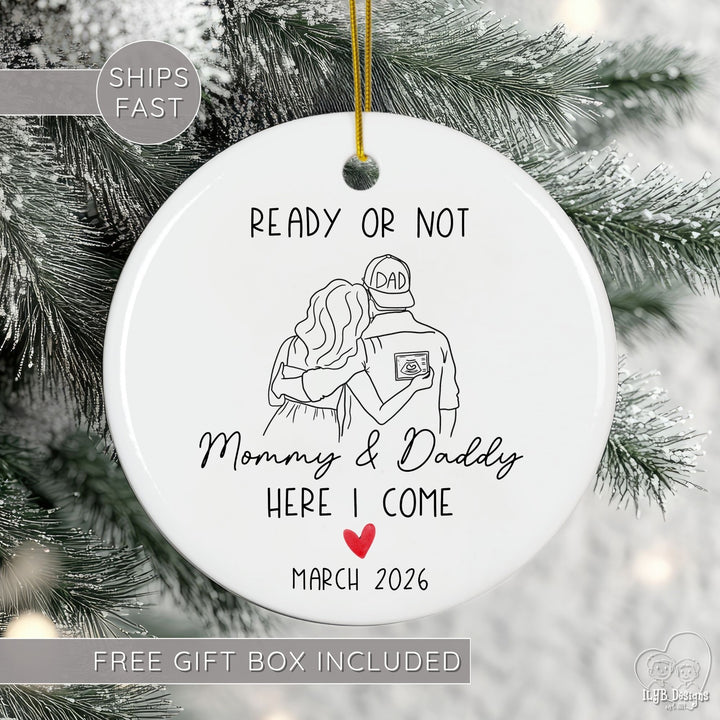 Ornament with 'Ready or Not Mommy & Daddy Here I Come March 2026' text on a Christmas tree.