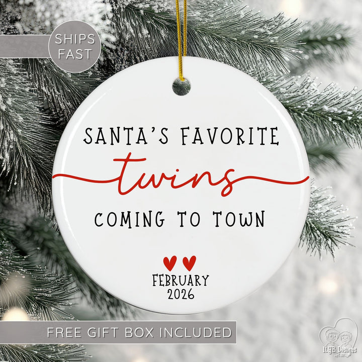 Christmas ornament with 'Santa's Favorite Twins Coming to Town' text on a tree.