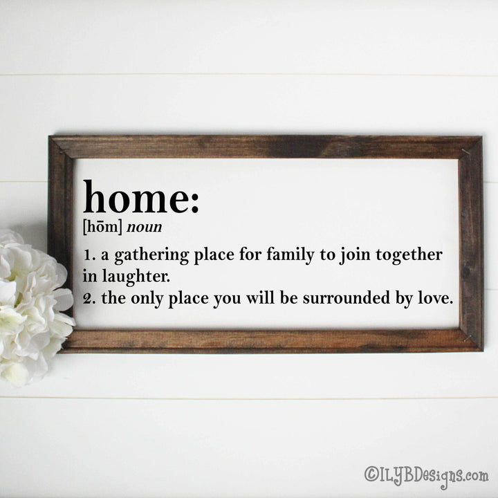 Framed canvas sign with definition of 'home: a gathering place for family to join together in laughter. The only place you will be surrounded by love.'