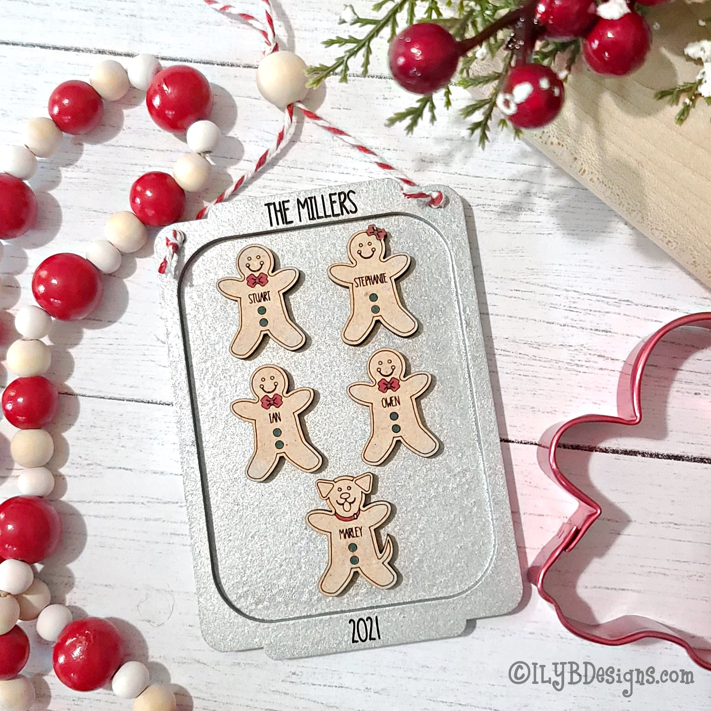Santa mask ornament with silver glitter inside 4 inch disc ornament. Santa face wearing a red mask with 2020 on it. Ribbon tied at the top of the ornament hanging on a Christmas tree.