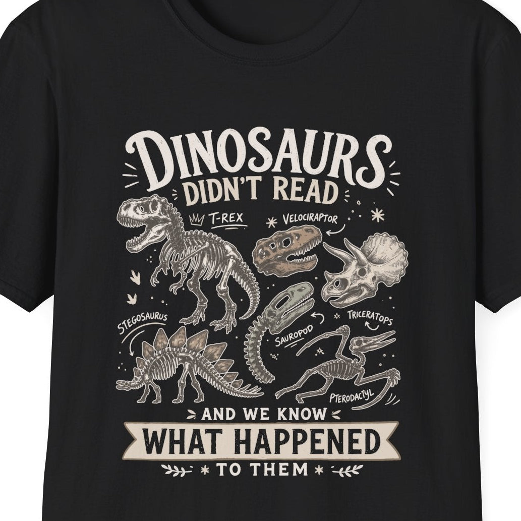 Black t-shirt with white text 'dinosaurs didn't read and we know what happened to them' on a white background
