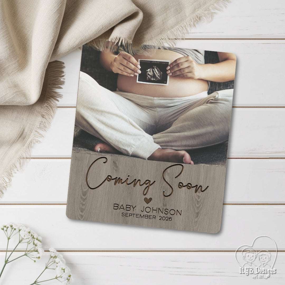 coming soon baby name announcement photo keepsake gift laying on white shiplap background