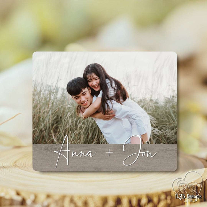 Personalized photo plaque with 'Anna + Jon' on a wooden surface