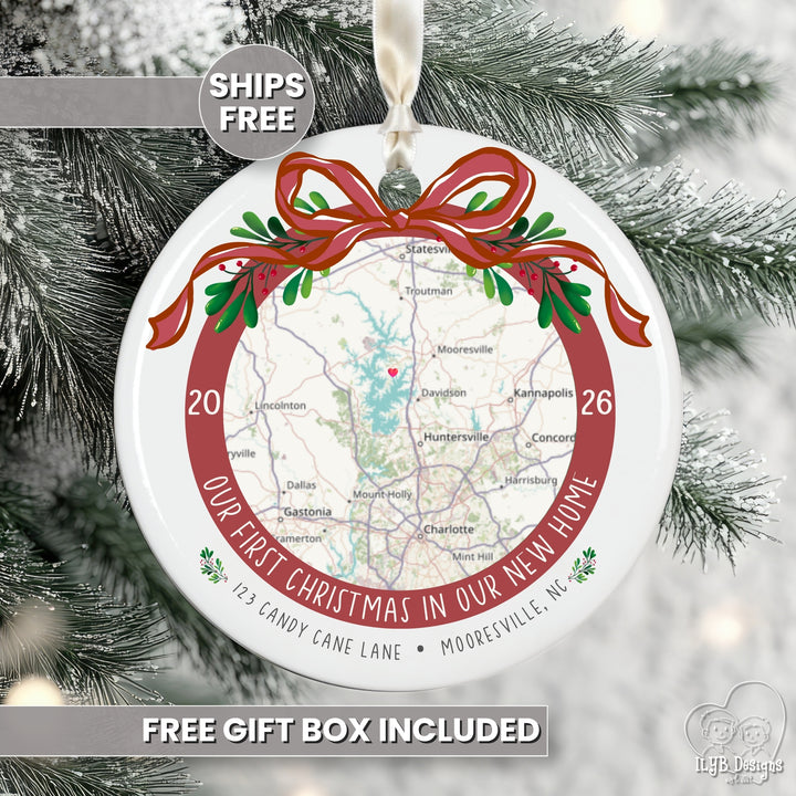 A round white Christmas ornament featuring a printed map of a home with a red circular border and text reading &