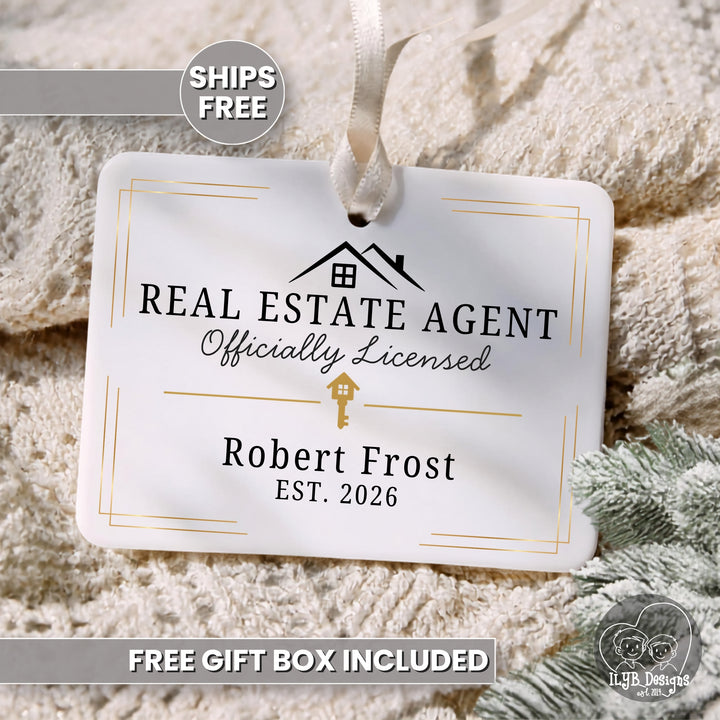 A personalized white hanging ornament with a ribbon loop, printed with &