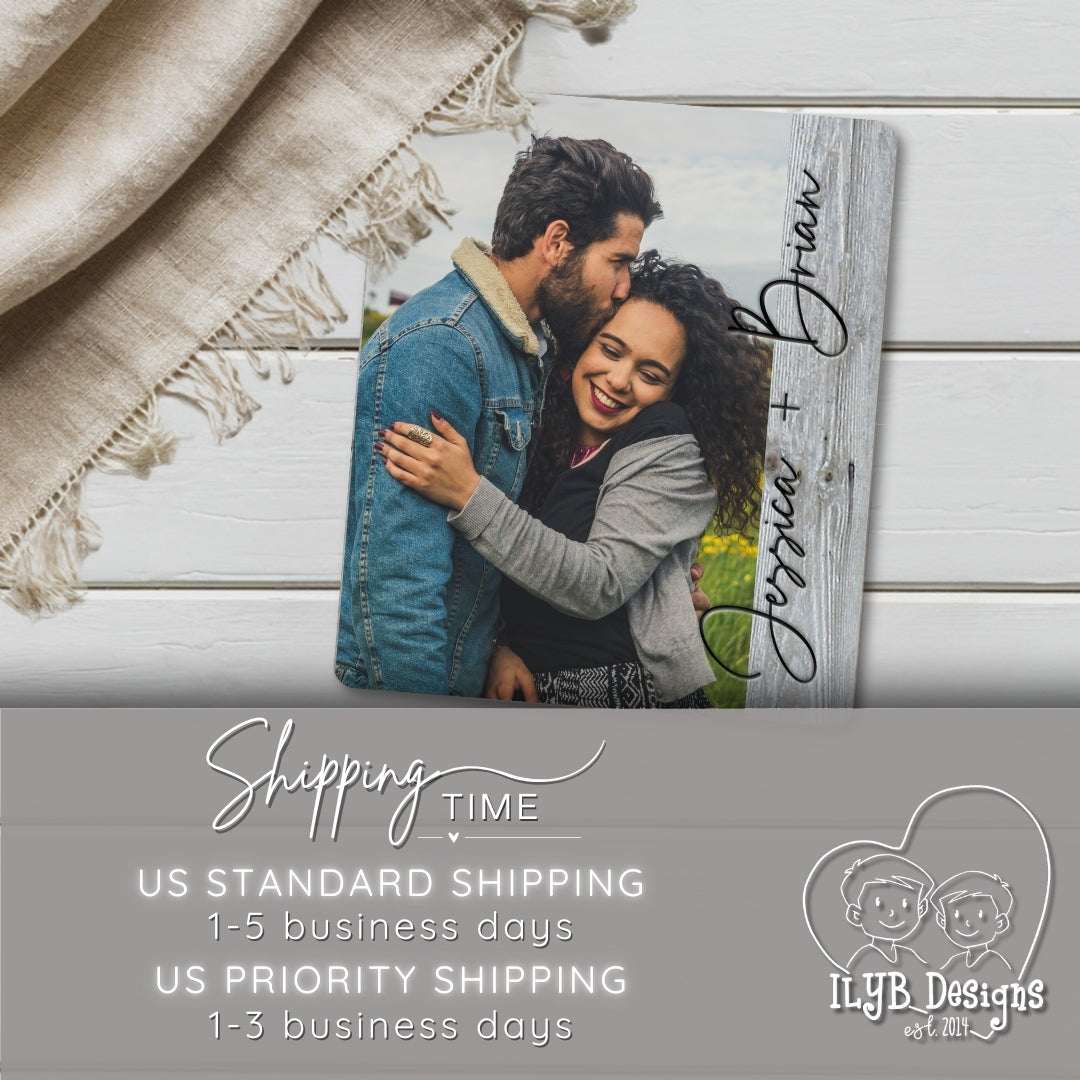 Personalized photo plaque with a couple's photo and names, displayed on a wooden surface.
