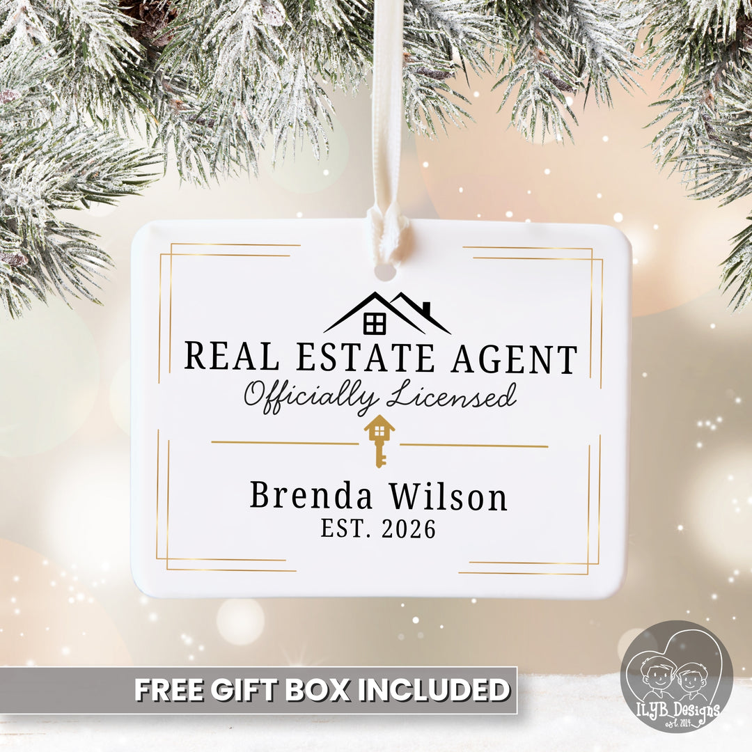 A white rectangular hanging ornament with rounded corners, printed with a black house icon and the text &