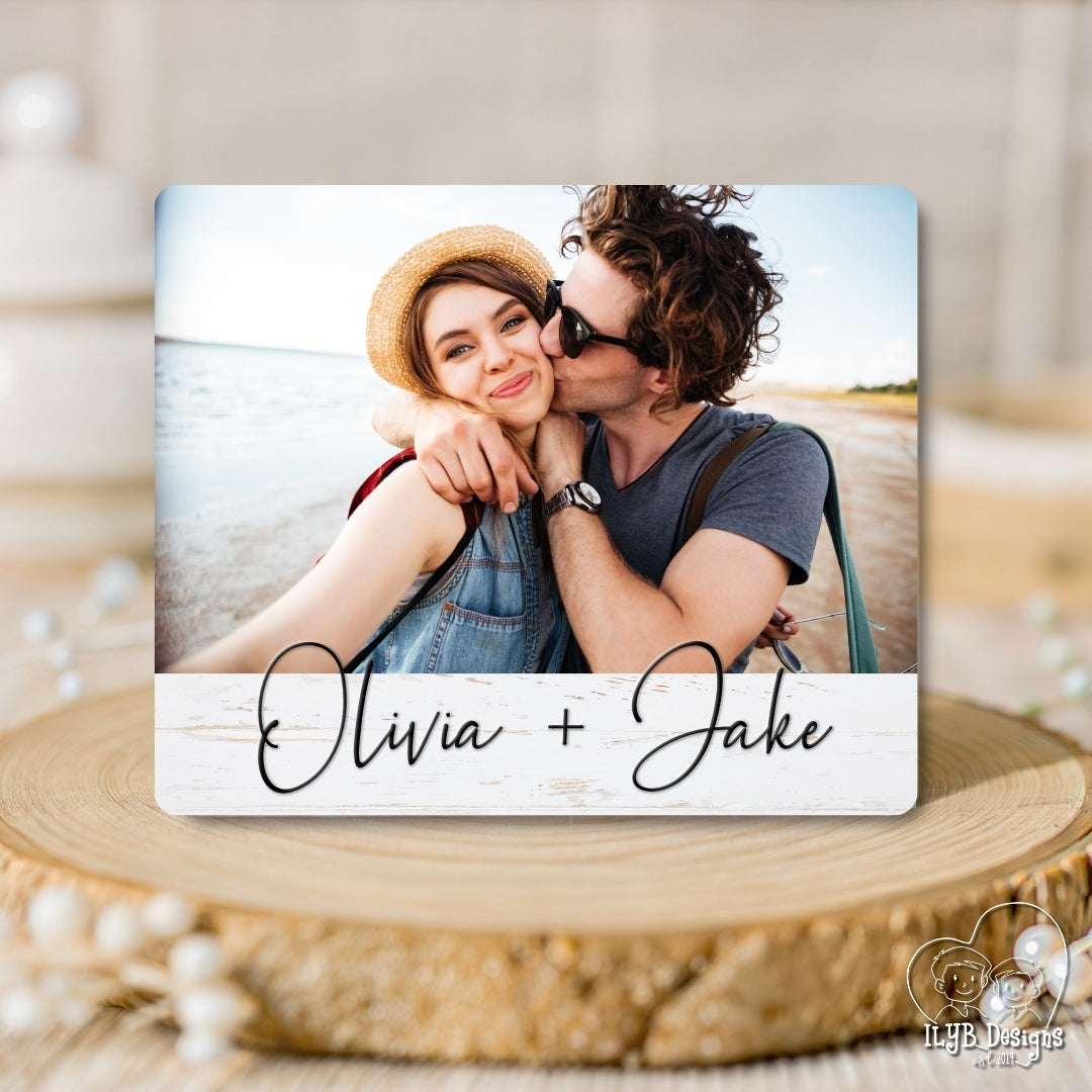 Personalized photo plaque with 'Olivia + Jake' on a wooden surface