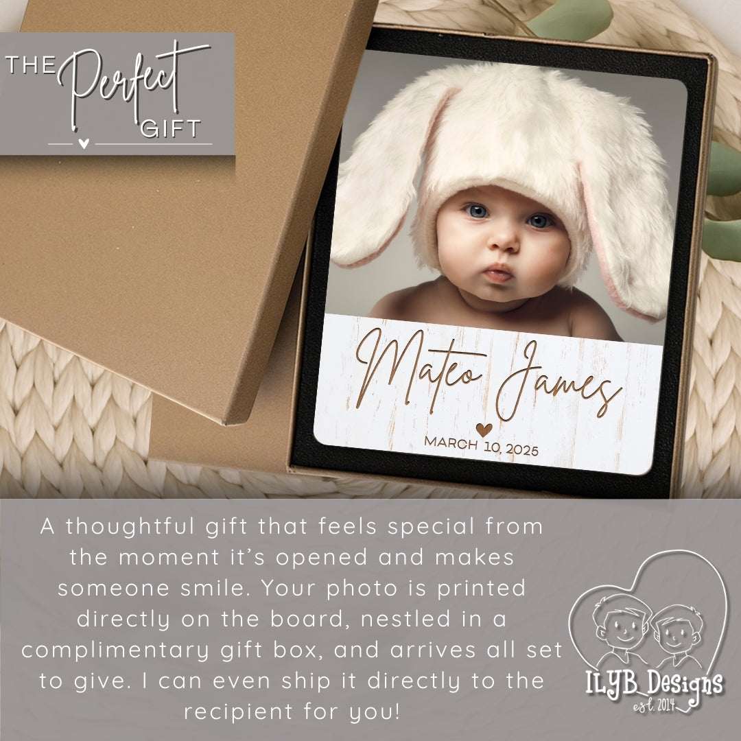 Personalized photo plaque with a baby's name and date, displayed in a gift box.