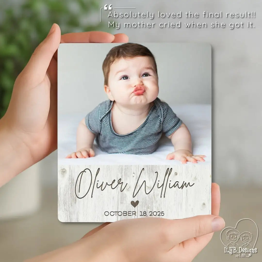 Person holding a photo plaque with a baby's photo and name, with a quote above.