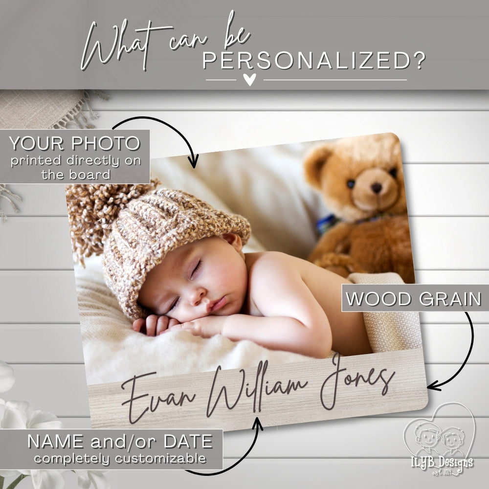 Wooden board with a photo of a sleeping baby and customizable text on a wooden surface.