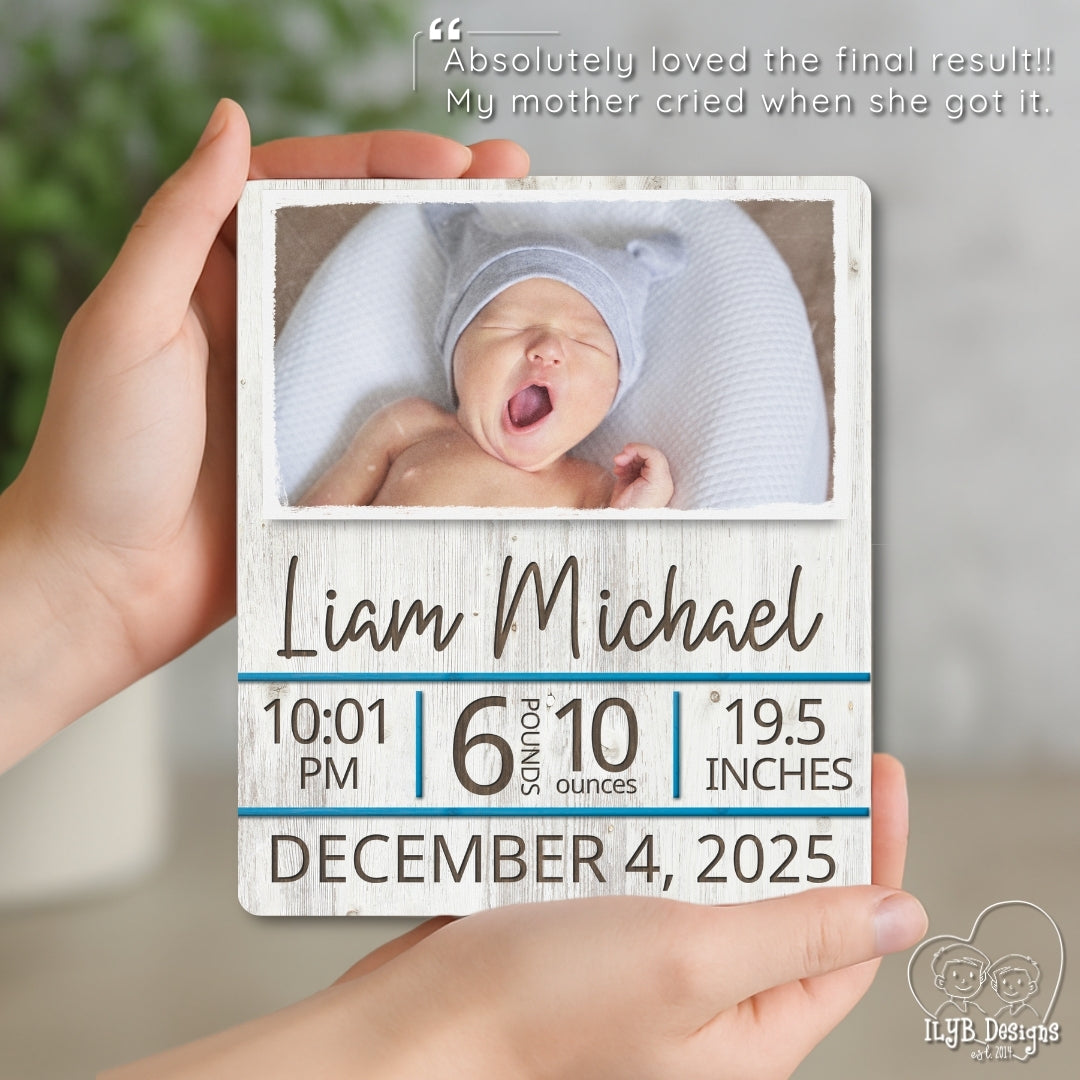 Baby photo frame with newborn baby's details held by a hand