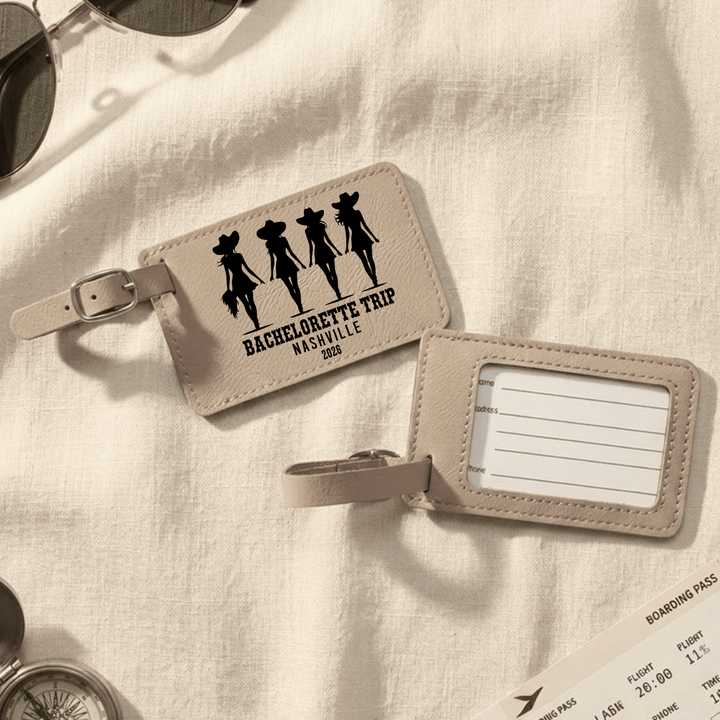 Beige luggage tag with 'Bachelorette Trip Nashville 2026' design on a light fabric background.