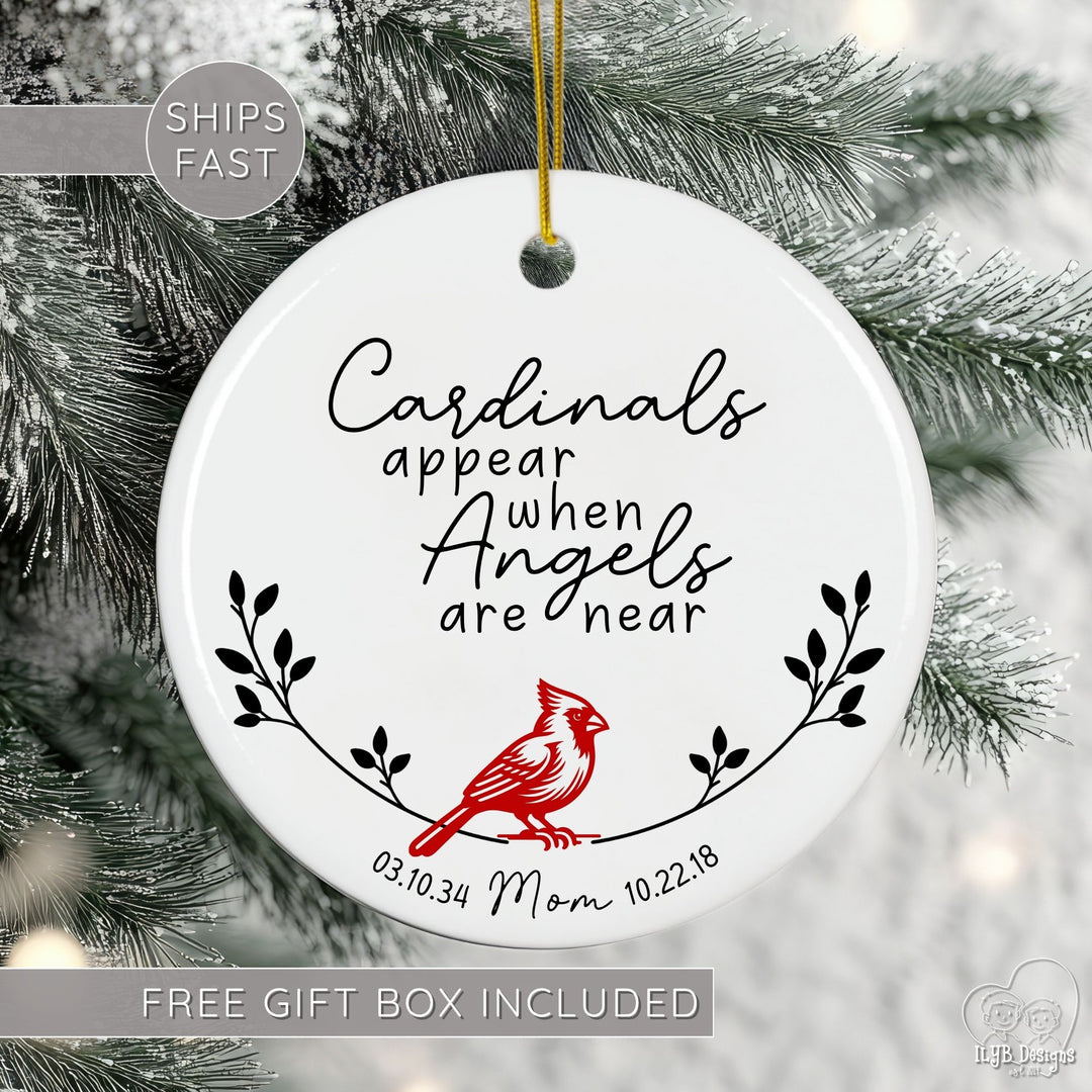 Personalized cardinal memorial ornament featuring the touching phrase “Cardinals appear when Angels are near.” Beautifully designed with a red cardinal, delicate branches, and your loved one’s name and birth/death dates, this ceramic ornament is a meaningful Christmas remembrance keepsake. Free gift box included. Ships fast.