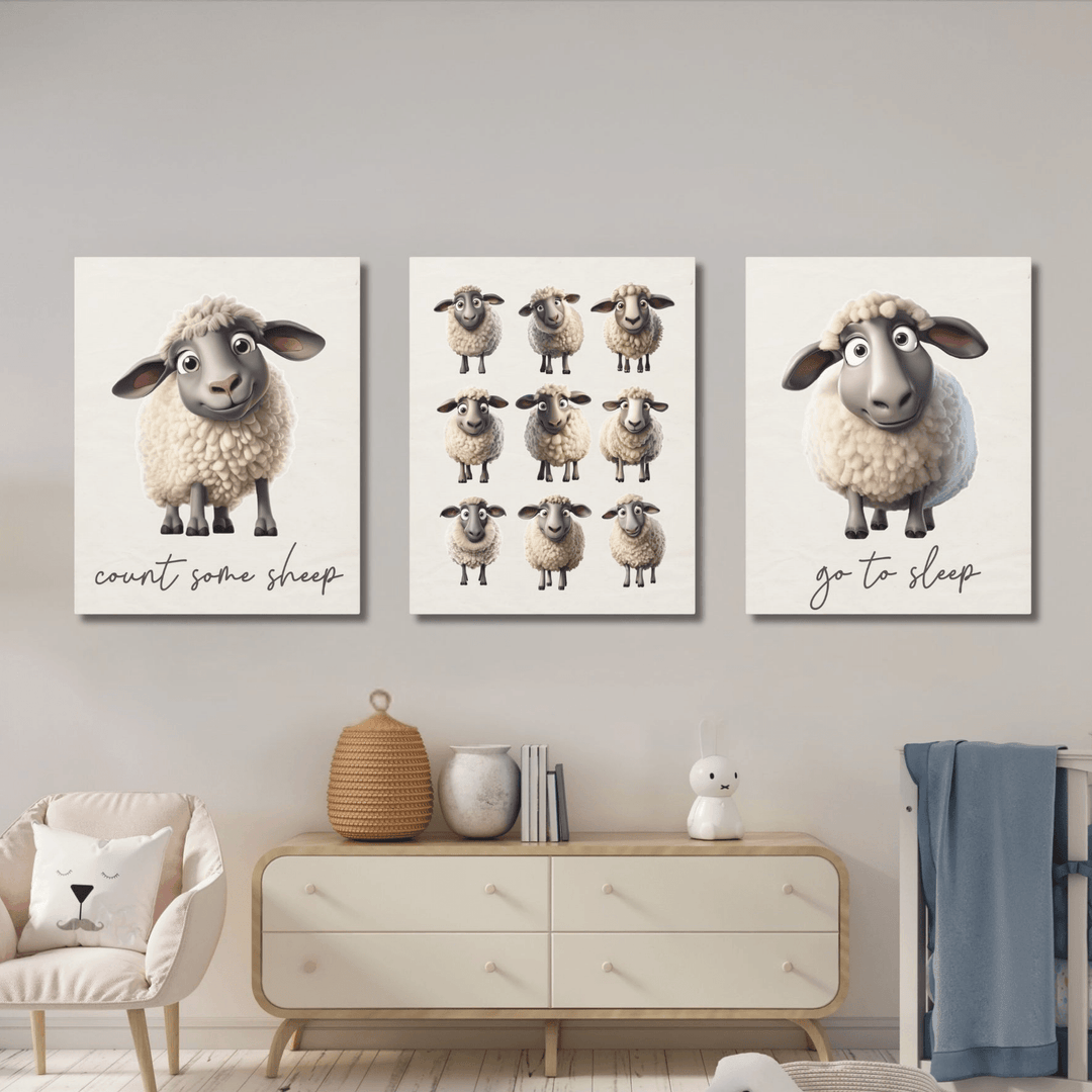 Three wall canvas art prints of cartoon sheep on a wall above a dresser in a kids room.