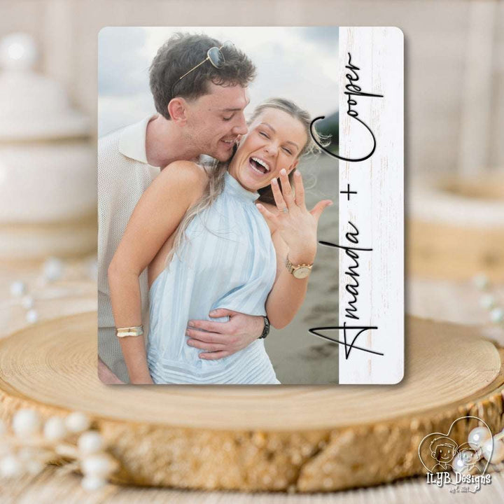 Personalized wood photo board with a couple on a wooden surface