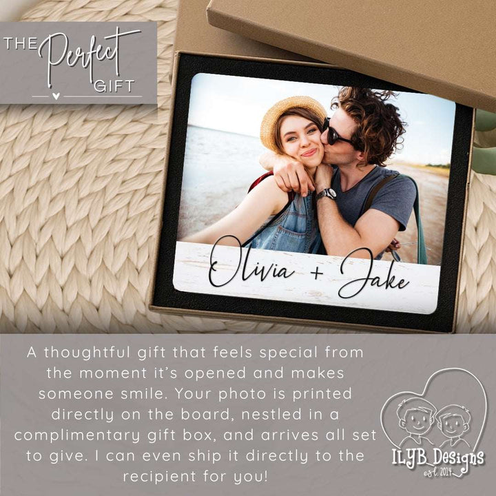 Personalized photo gift with a couple's photo and names, placed on a textured surface.