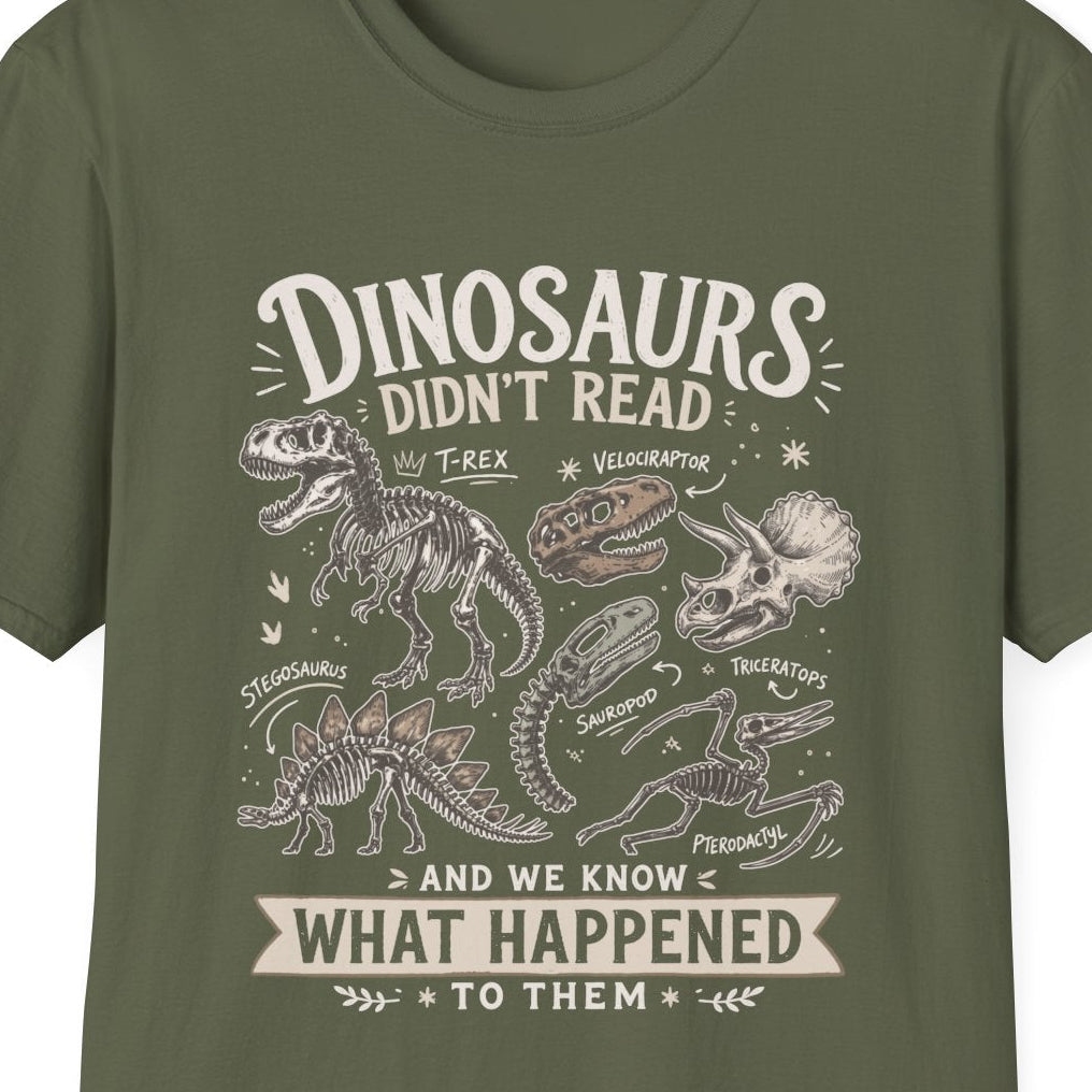 An olive green short-sleeve crewneck t-shirt with a vintage-style dinosaur graphic and text on the front, displayed against a solid white background.