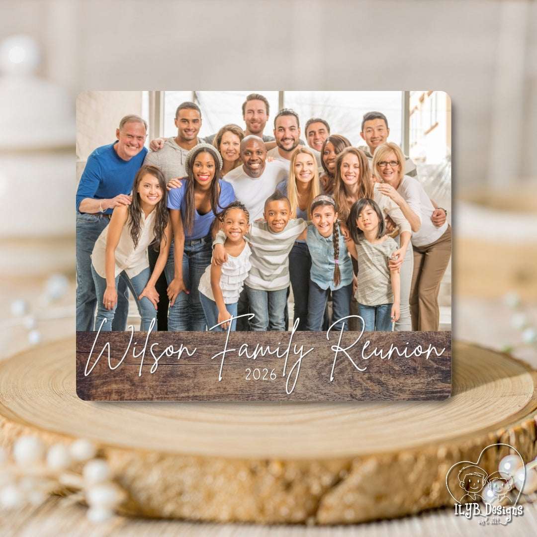 Family reunion photo plaque with a group photo of a family on a wooden surface.