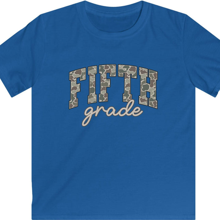 A royal blue short-sleeve t-shirt with a graphic on the chest reading 'FIFTH grade'. The word 'FIFTH' is styled in an arched collegiate font filled with a brown and beige camouflage pattern, while 'grade' is written below in a light beige cursive script.