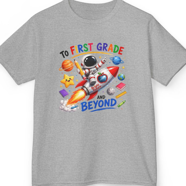 A heather gray short-sleeve t-shirt with a colorful graphic on the front that reads 'TO K NDERGARTEN AND BEYOND' around an astronaut and rocket illustration, shown on a plain white background.
