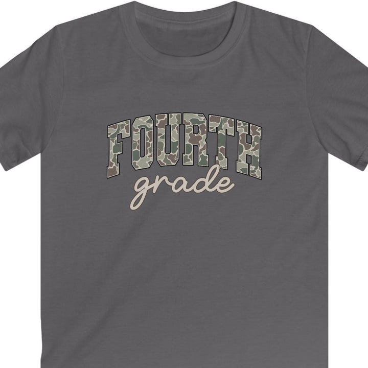 A dark gray short-sleeve t-shirt with 'FOURTH grade' printed on the chest. The word 'FOURTH' is styled in a camouflage pattern, while 'grade' is written below in a light beige cursive font, all against a plain white background.