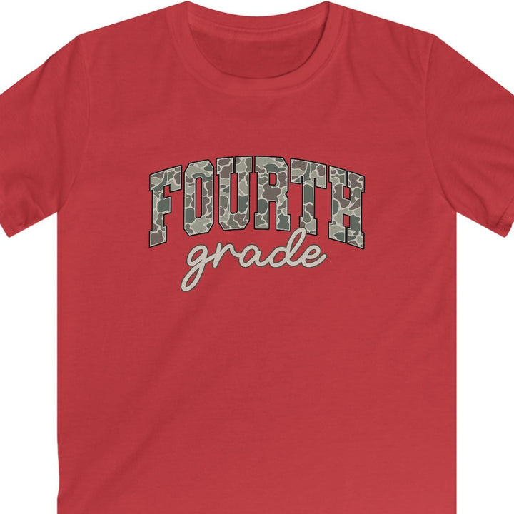 A red short-sleeve crewneck t-shirt with 'FOURTH grade' printed on the chest. The word 'FOURTH' is in a gray camouflage pattern, and 'grade' is written below in white cursive script, all on a solid white background.