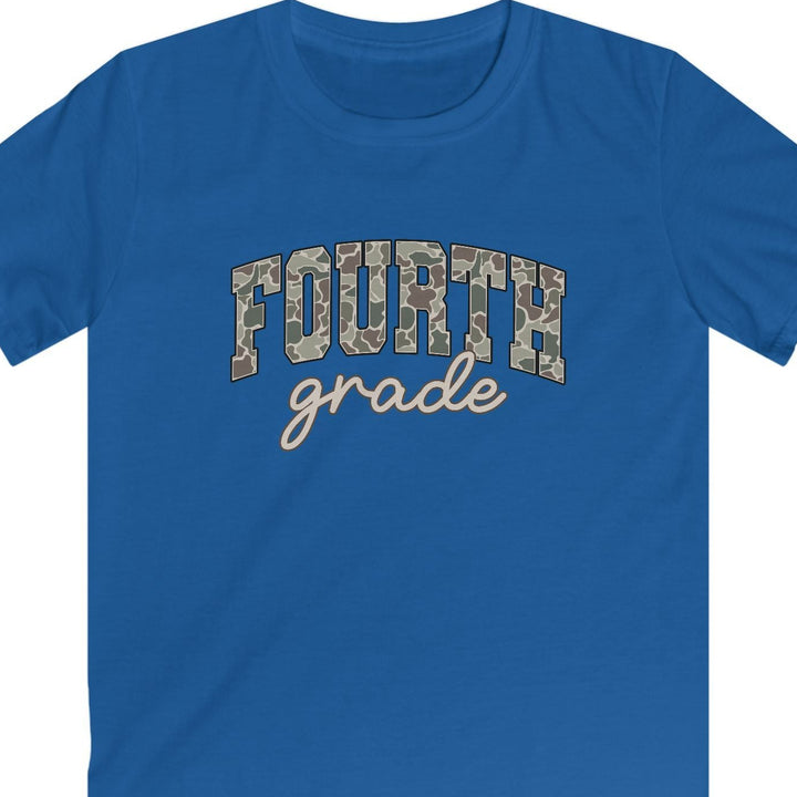 A royal blue short-sleeve t-shirt with 'FOURTH grade' printed on the chest. The word 'FOURTH' is styled in a camouflage pattern, while 'grade' is written below in a light beige cursive font, all on a solid white background.