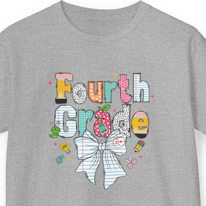 A heather gray short-sleeve t-shirt with a colorful graphic on the front that reads 'Fourth Grade' in playful multicolored letters, decorated with a white plaid bow, a strawberry, and small doodle-style icons, shown on a plain white background.