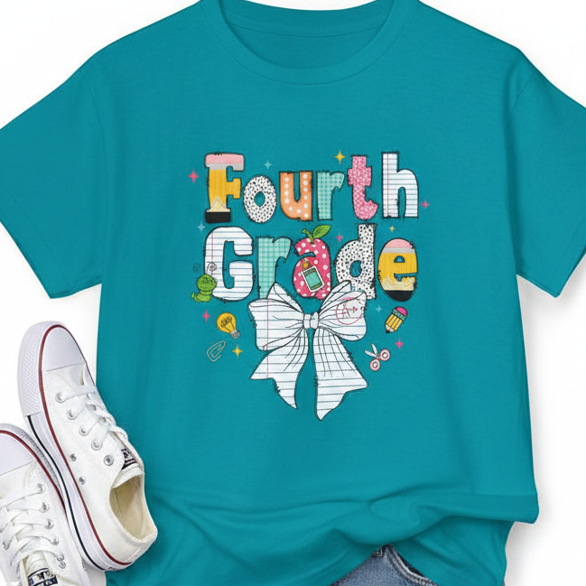 A teal short-sleeve t-shirt with a colorful graphic on the front that reads 'Fourth Grade' in playful hand-drawn lettering, decorated with a white bow, and small school doodles, shown against a plain white background.