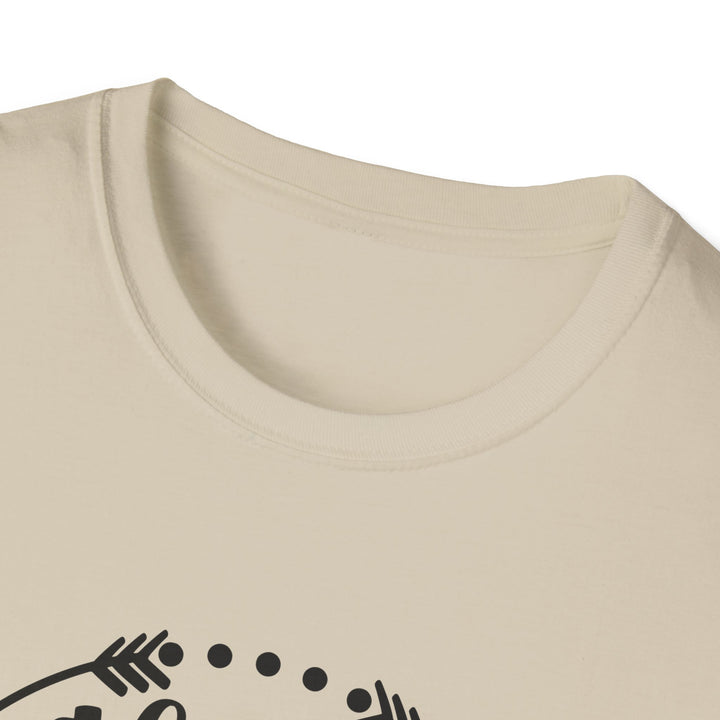 Close-up of a cream-colored crewneck t-shirt showing the collar and a partial black graphic print at the bottom.