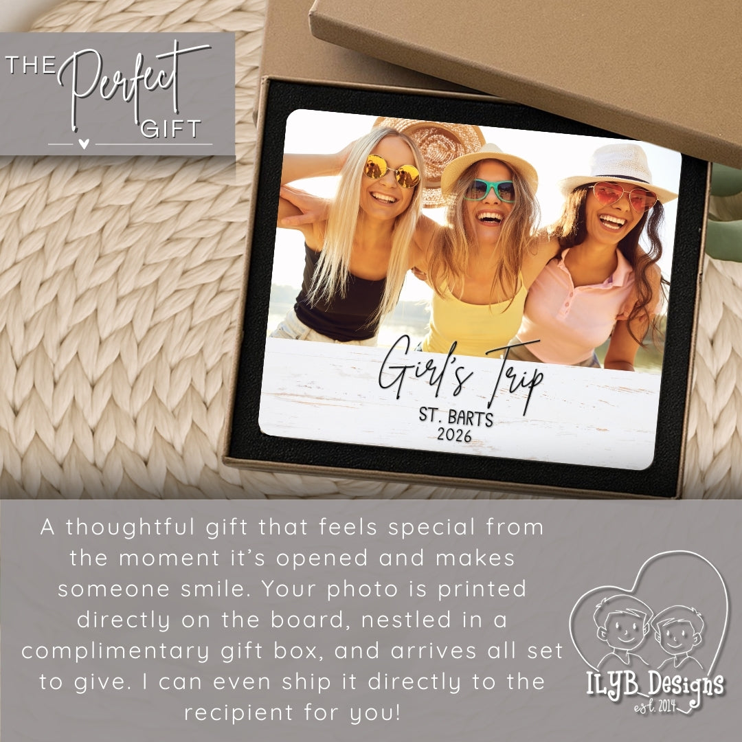 Photo board with a printed photo of three women on a 'Girl's Trip' to St. Barts, 2026, with promotional text about the product.