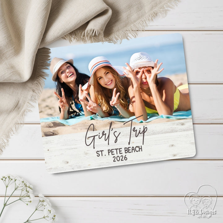 Photo board with a photo of three women on a beach and 'Girl's Trip St. Pete Beach 2026' text.
