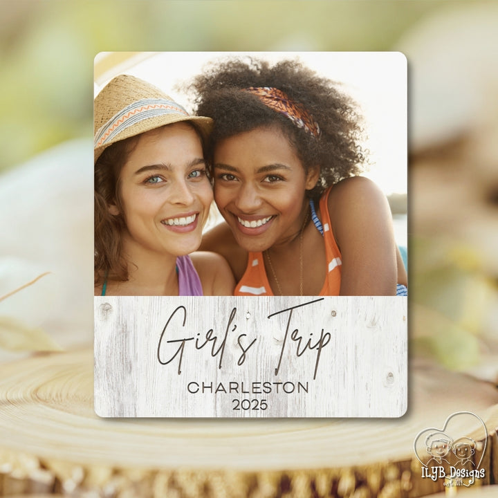 Two women smiling with 'Girl's Trip Charleston 2025' text overlay on a wooden surface.