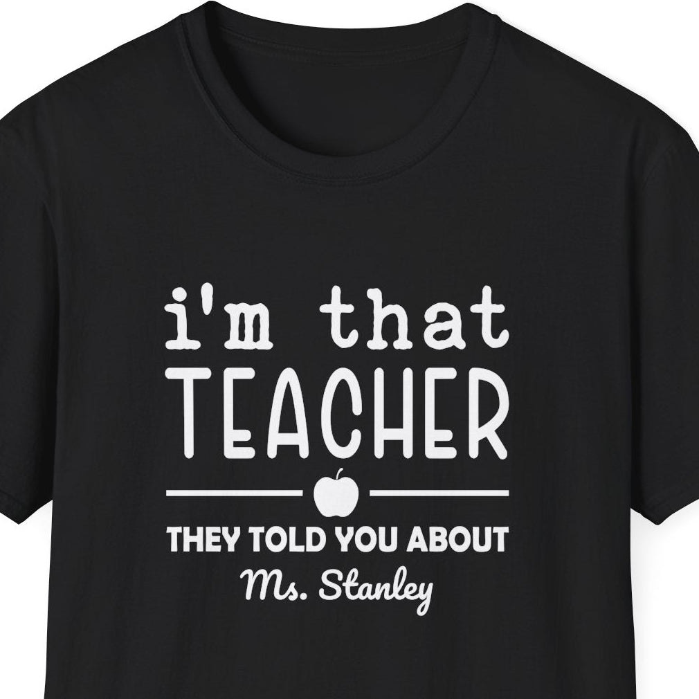 Black t-shirt with 'i'm that teacher they told you about' text on a white background