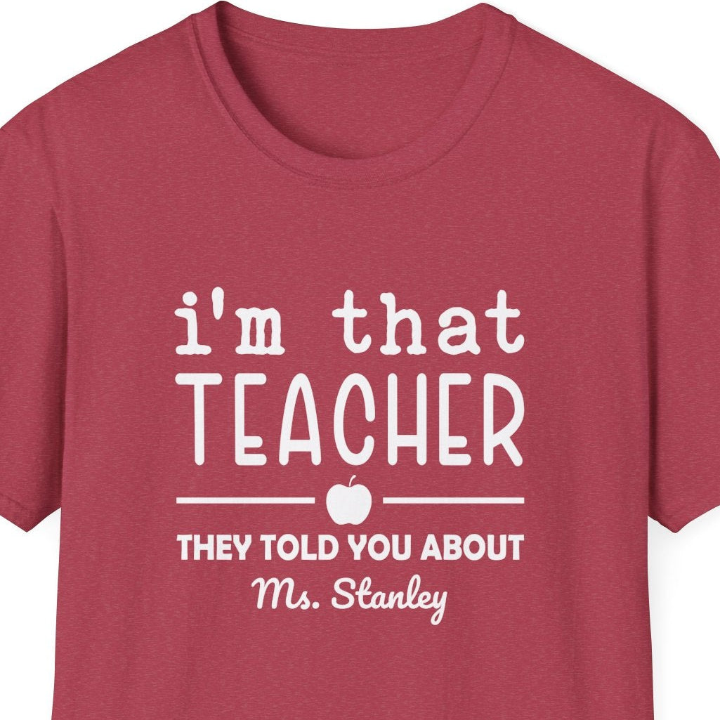 Red t-shirt with a white graphic design that says 'i'm that teacher they told you about' on a white background