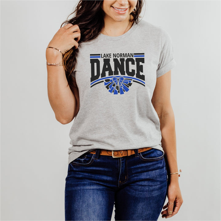 Person wearing a gray t-shirt with 'Lake Norman Dance' design on a plain background