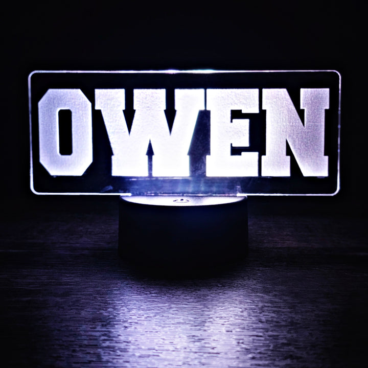 LED night light with the name 'OWEN' on a dark background