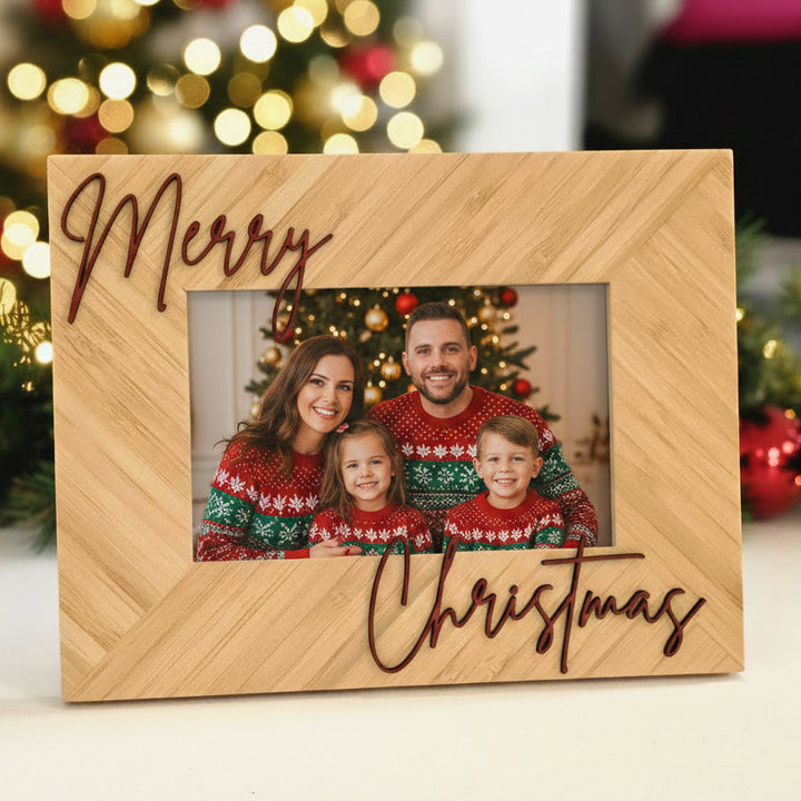 A rectangular wooden picture frame with a herringbone pattern, featuring the words &