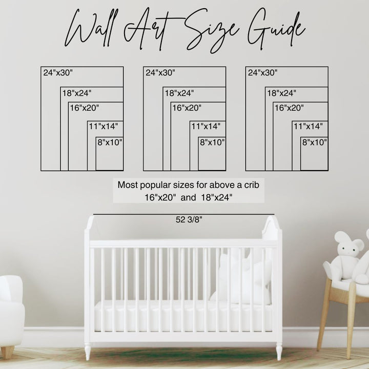 Wall art size guide for nursery wall decor with crib and teddy bear in the background. Most popular sizes for above crib are 16"x20" and 18"x24"