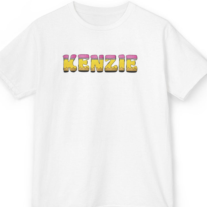 A white short-sleeve crewneck t-shirt featuring the word 'KENZIE' printed across the chest in a 3D pencil letter font.