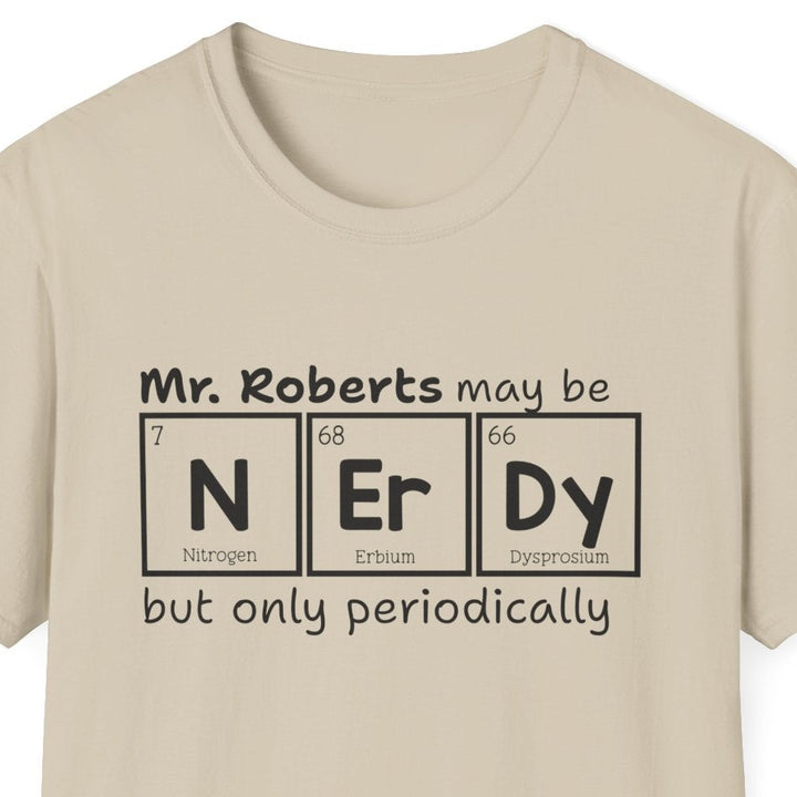 A light beige crewneck t-shirt with a black graphic print on the chest. The shirt has a black text graphic that reads 'Mr. Roberts may be nerdy but only periodically' with nerdy spelled out in periodic elements.