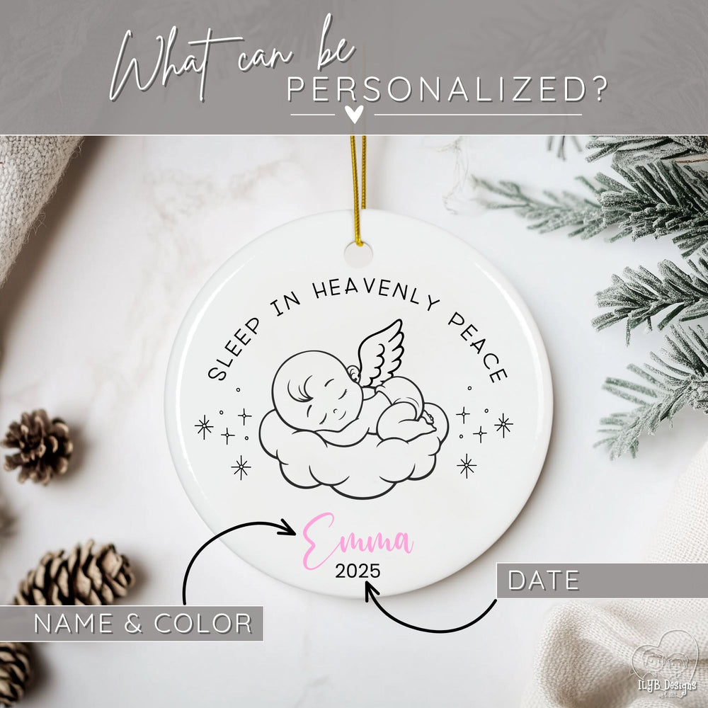 Graphic showing the personalized baby memorial ornament featuring the tender phrase “Sleep in Heavenly Peace.” A sweet line drawing of an angel baby resting on a cloud surrounded by stars creates a touching keepsake. Graphic shows you can personalize the name and color of name along with the date/s to appear on ornament.