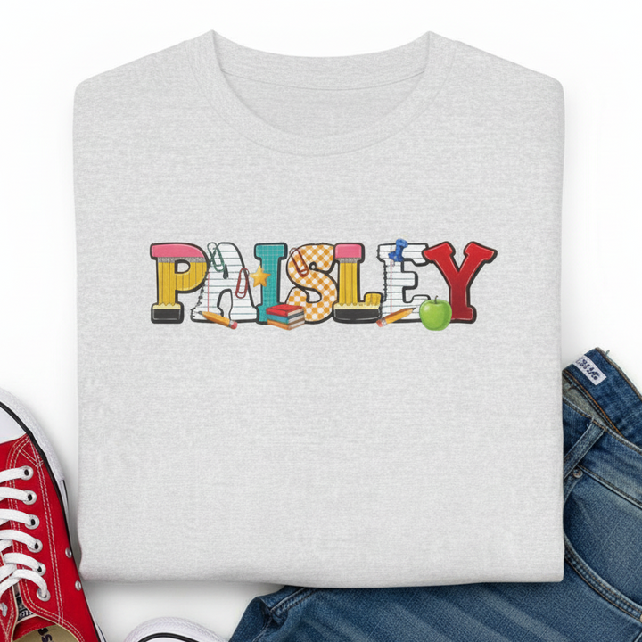 A folded light ash gray t-shirt featuring a colorful &