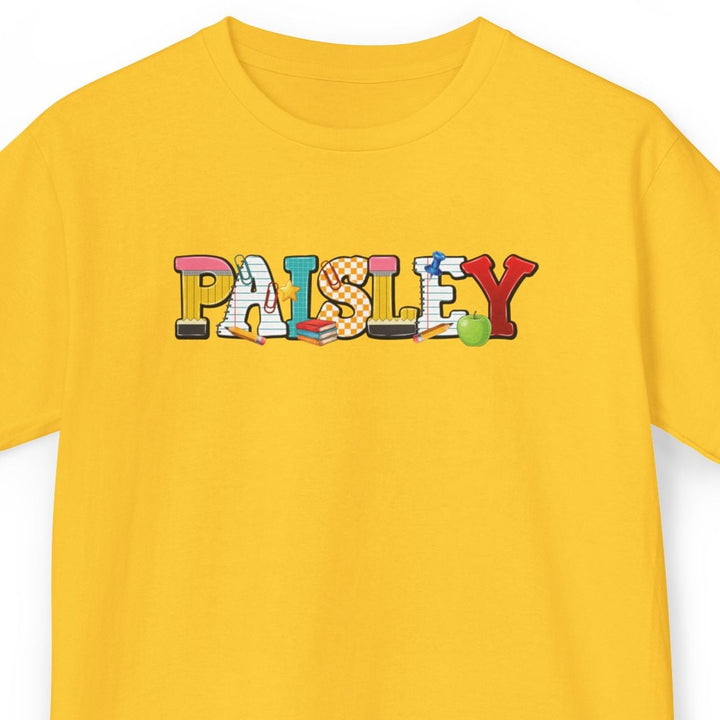 A yellow short-sleeve t-shirt with a colorful graphic spelling 'Paisley' across the chest, shown on a plain white background.