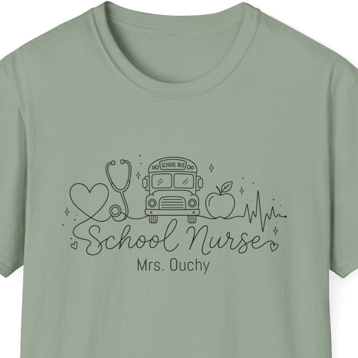 Sage t-shirt with black line drawn school nurse graphic and text on a white background