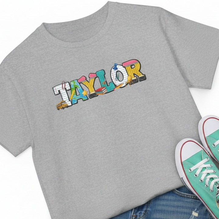 A heather gray short-sleeve T-shirt laid flat with a colorful &