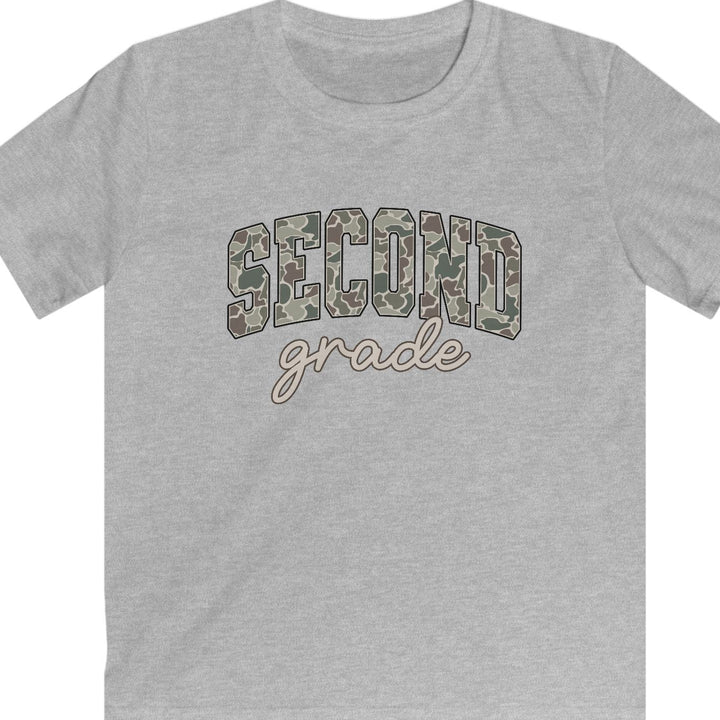 A heather gray short-sleeve t-shirt with 'SECOND grade' printed on the chest. The word 'SECOND' is in an arched block font filled with a green, brown, and beige camouflage pattern, while 'grade' is written below in a brown cursive script outline.