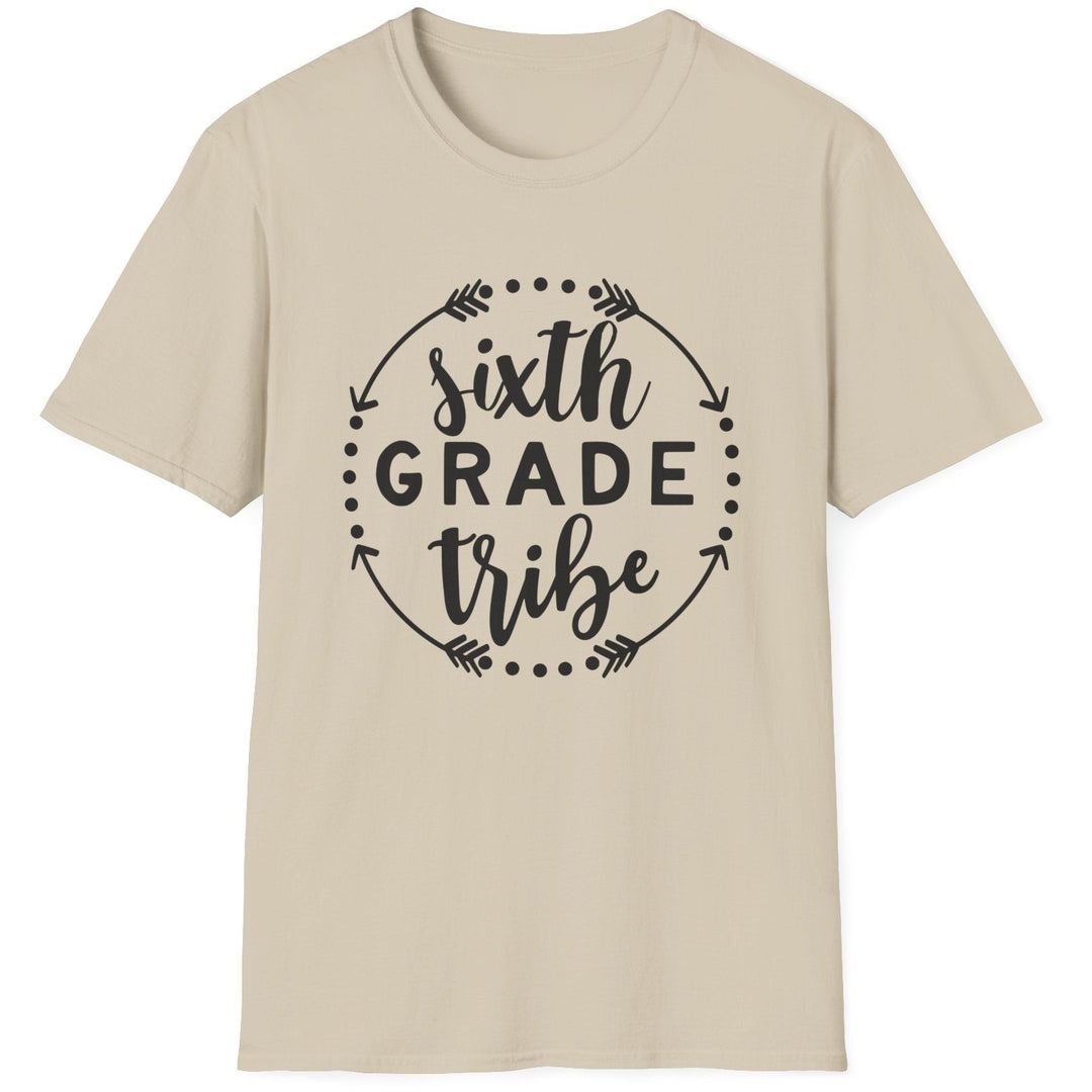 A light beige crewneck t-shirt with a black graphic on the chest that reads 'sixth GRADE tribe' inside a circular arrow design, shown on a plain white background.